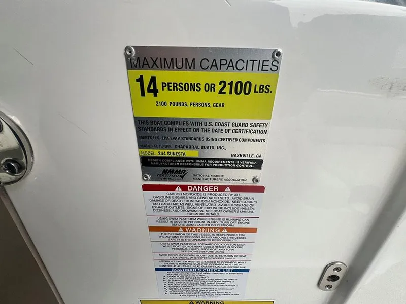 Slide: The Image of 2013 Chaparral 244 Sunesta capacity label: 14 persons or 2100 lbs. - 21