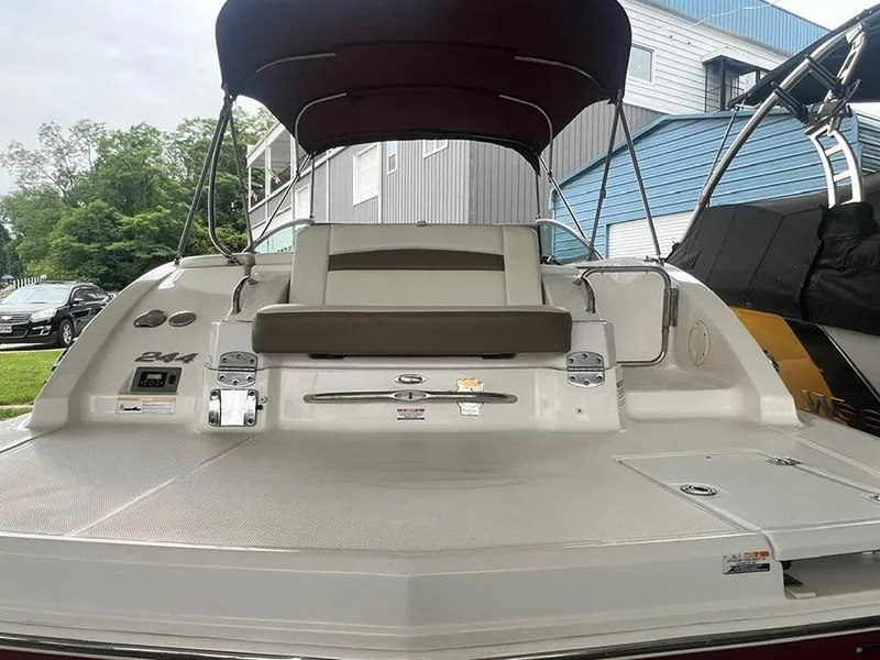 Slide: The Image of 2013 Chaparral 244 Sunesta boat with rear seating and canopy. - 6