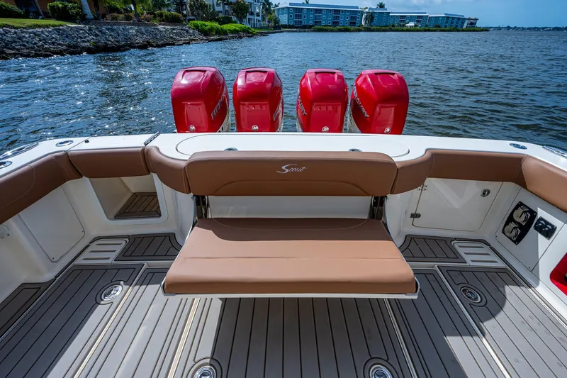Slide: The Image of 2017 Scout 420 LXF boat with four red outboard engines on water. - 30
