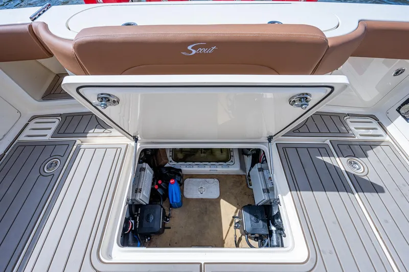 Slide: The Image of 2017 Scout 420 LXF boat storage compartment with open hatch. - 33