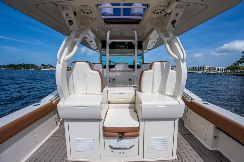Slide: The Image of 2017 Scout 420 LXF boat interior with seating and ocean view. - 38