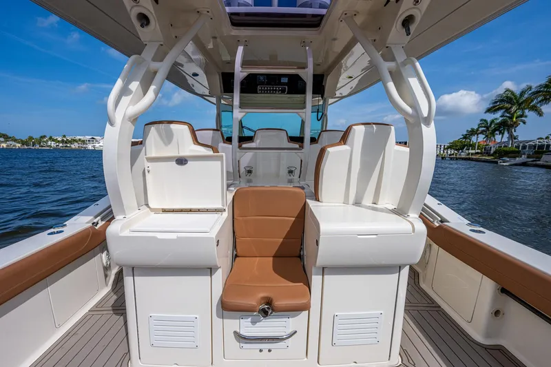 Slide: The Image of 2017 Scout 420 LXF boat interior with seating and storage compartments. - 40