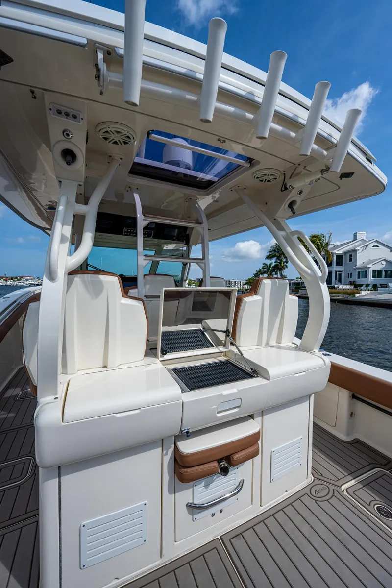 Slide: The Image of 2017 Scout 420 LXF boat interior with seating and storage compartments. - 41