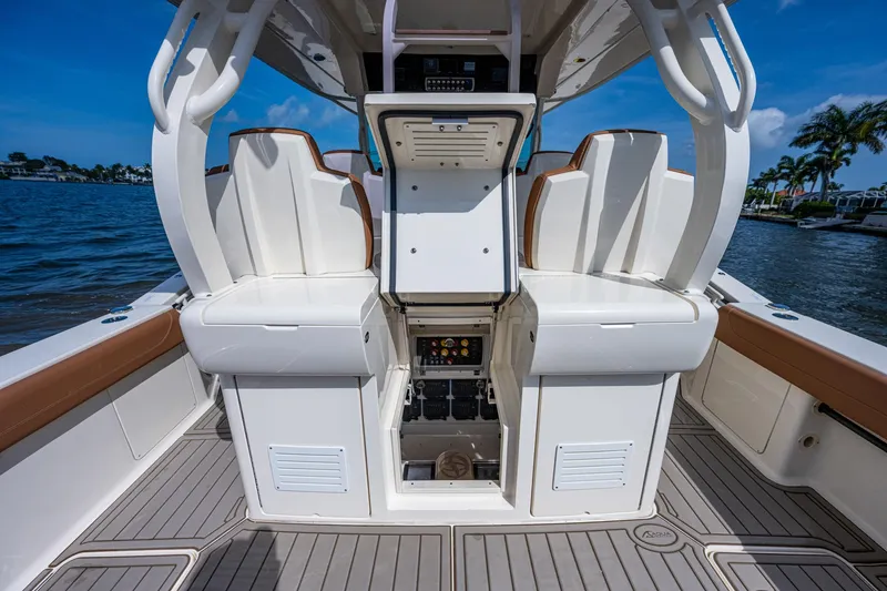 Slide: The Image of 2017 Scout 420 LXF boat interior with seating and storage compartments. - 43