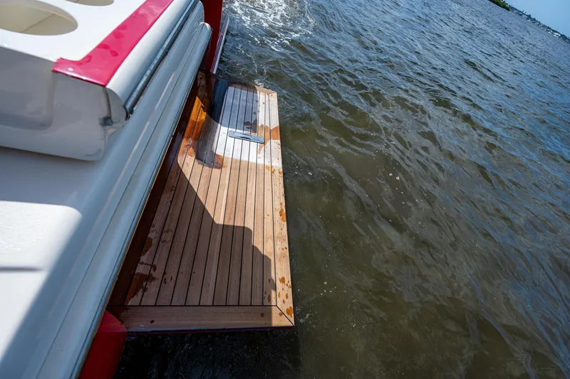 Slide: The Image of 2017 Scout 420 LXF swim platform on water. - 45