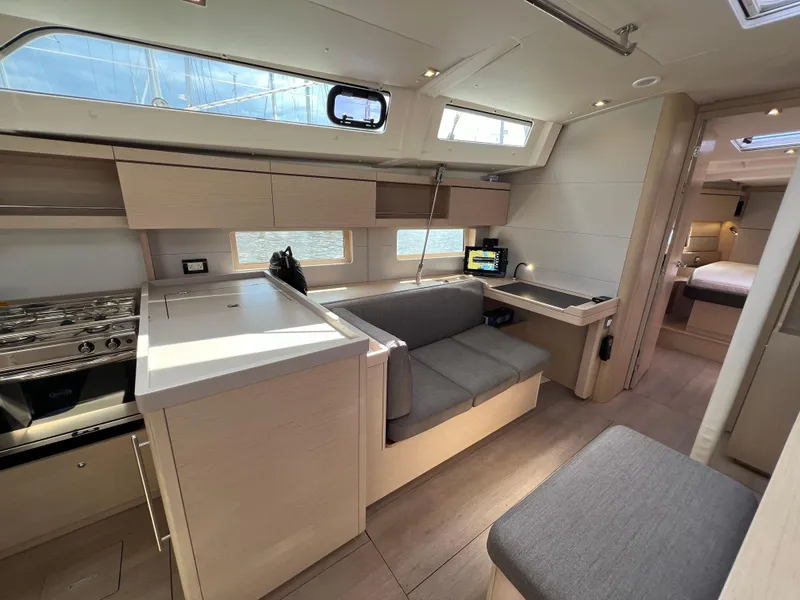Slide: The Image of Interior of 2020 Beneteau Oceanis 46.1 yacht with modern kitchen and seating area. - 18