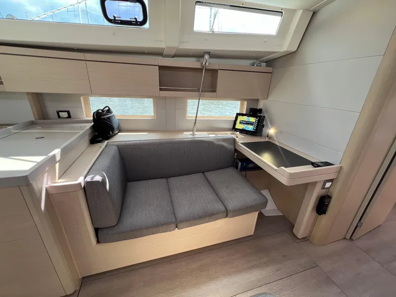 Slide: The Image of Interior of 2020 Beneteau Oceanis 46.1 yacht with modern seating and navigation station. - 19
