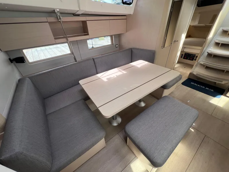 Slide: The Image of Interior of 2020 Beneteau Oceanis 46.1 yacht with modern seating and dining area. - 23