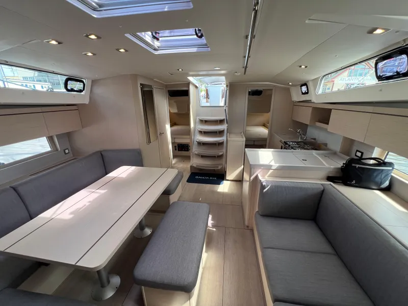 Slide: The Image of Interior of 2020 Beneteau Oceanis 46.1 yacht, featuring modern seating and dining area. - 24