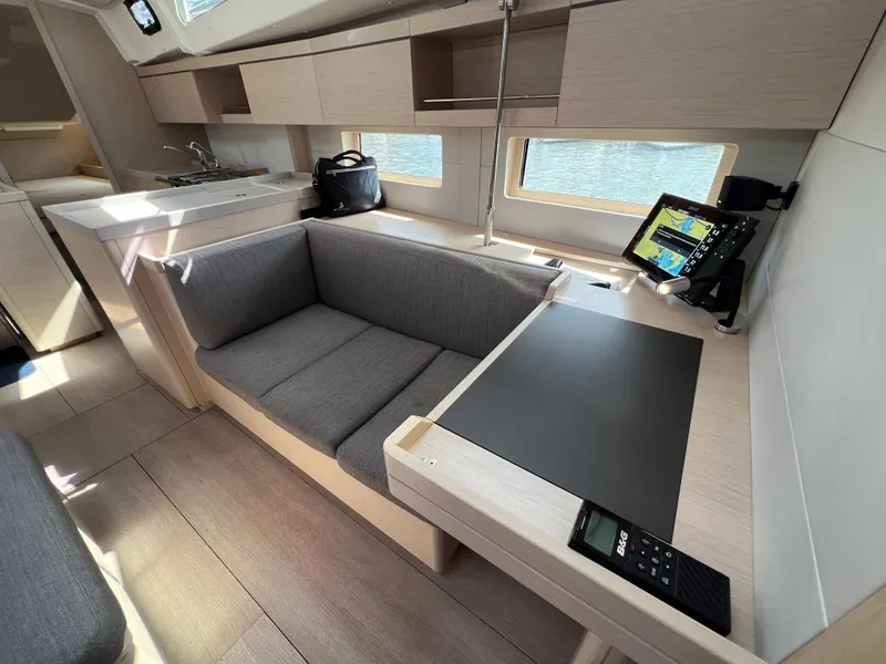 Slide: The Image of Modern interior of 2020 Beneteau Oceanis 46.1 yacht with sleek seating and navigation equipment. - 25