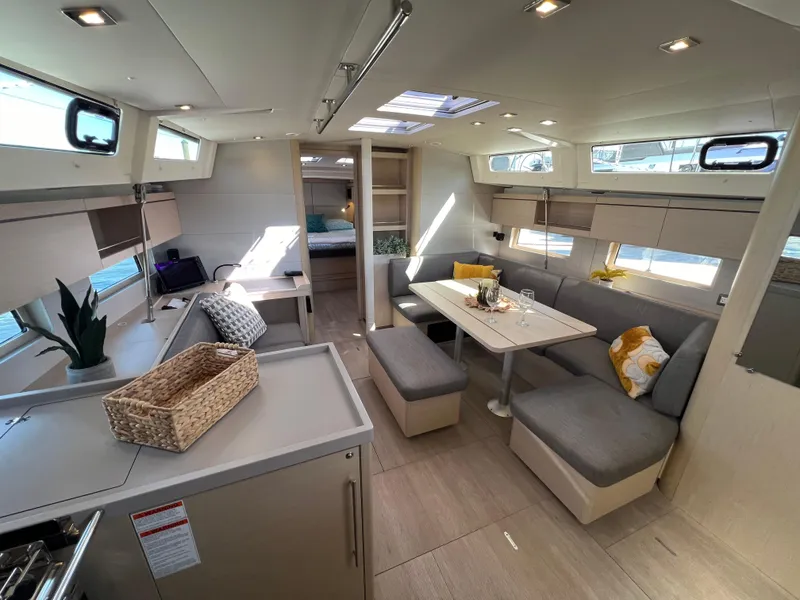 Slide: The Image of Luxurious interior of 2020 Beneteau Oceanis 46.1 yacht with modern dining area and cozy seating. - 28