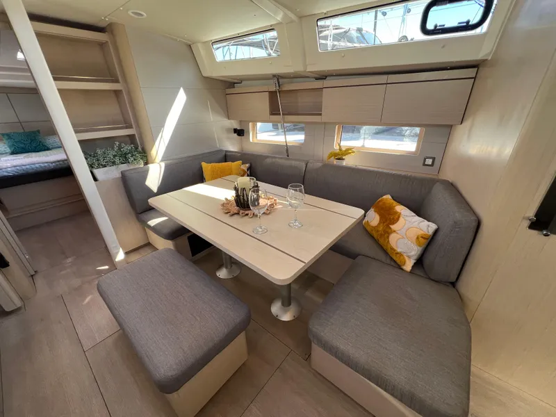 Slide: The Image of Interior of 2020 Beneteau Oceanis 46.1 yacht with modern seating and dining area. - 29