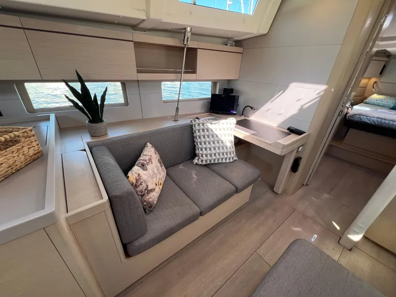 Slide: The Image of Interior of 2020 Beneteau Oceanis 46.1 yacht with modern seating and decor. - 30