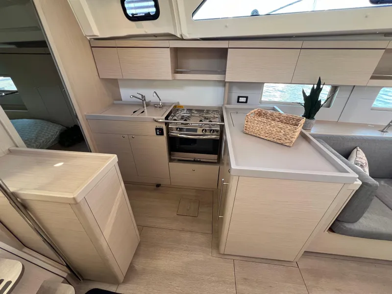 Slide: The Image of Modern kitchen in 2020 Beneteau Oceanis 46.1 yacht with stove, sink, and cabinetry. - 31