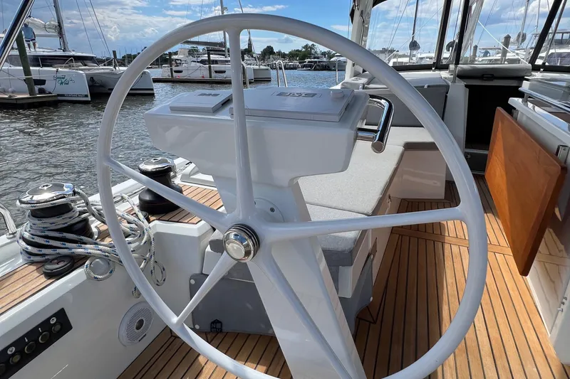 Slide: The Image of Steering wheel of 2020 Beneteau Oceanis 46.1 yacht, docked in marina. - 32