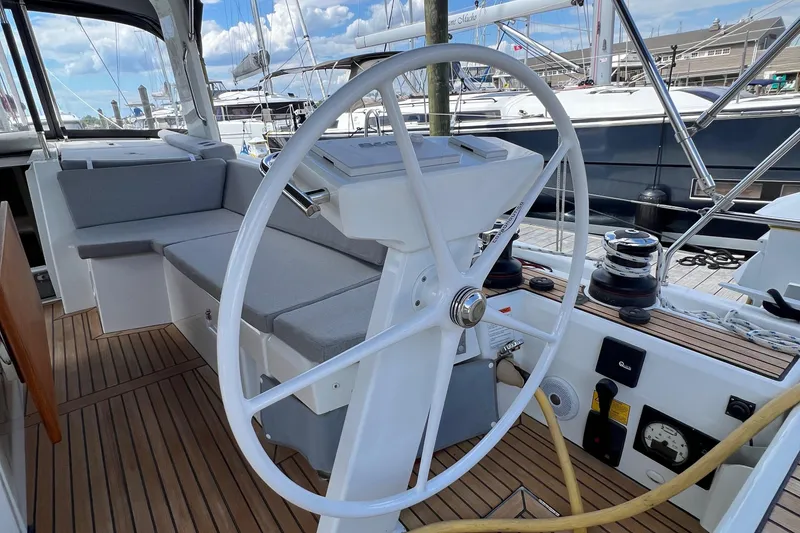 Slide: The Image of Beneteau Oceanis 46.1 yacht cockpit with steering wheel, 2020 model, docked at marina. - 33