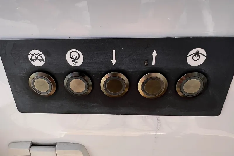 Slide: The Image of Control panel with five buttons on a 2020 Beneteau Oceanis 46.1 yacht. - 37