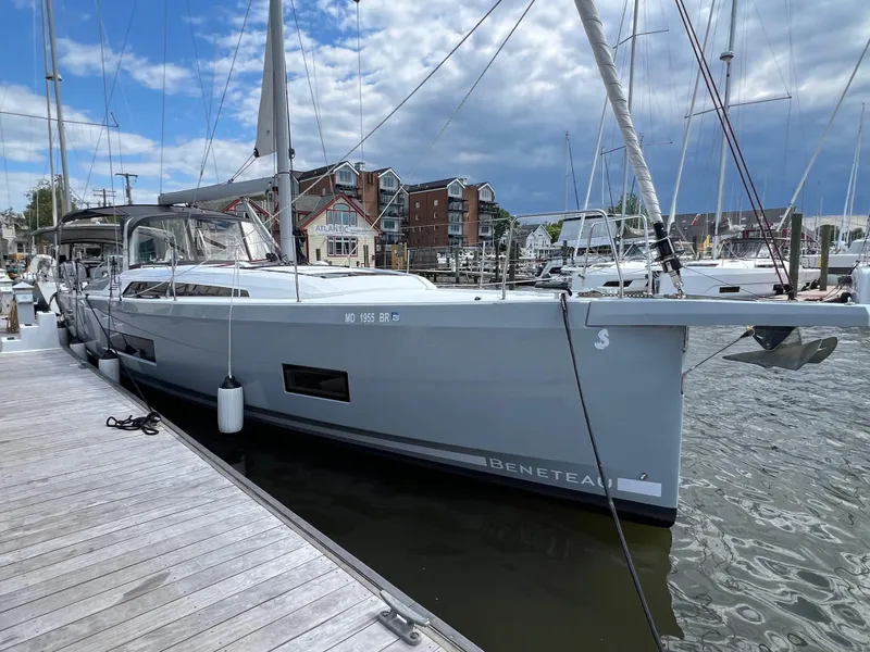 Slide: The Image of 2020 Beneteau Oceanis 46.1 yacht docked at marina under cloudy sky. - 5