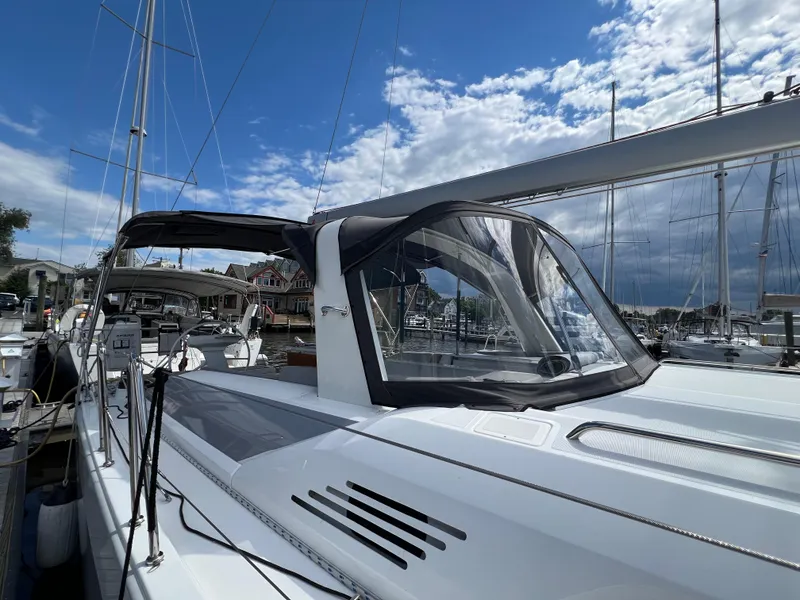 Slide: The Image of 2020 Beneteau Oceanis 46.1 sailboat docked under a partly cloudy sky. - 6