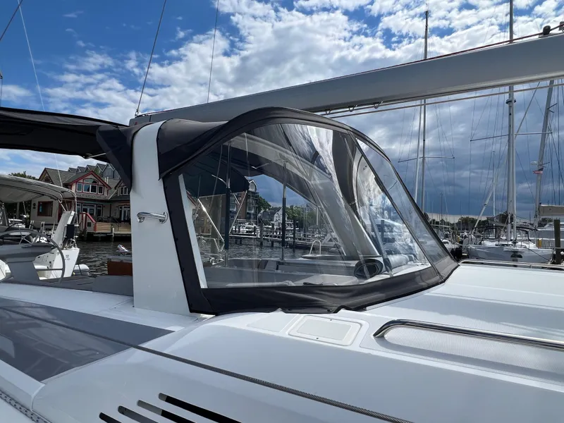 Slide: The Image of 2020 Beneteau Oceanis 46.1 sailboat docked at marina under blue sky. - 7