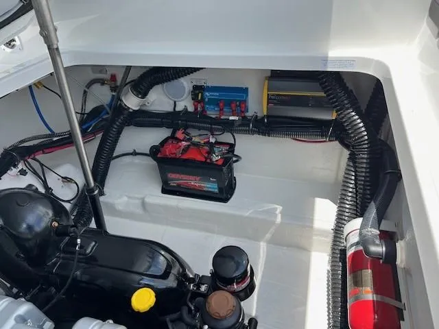 Slide: The Image of 2025 Formula 290 Bowrider engine compartment with battery and fire extinguisher. - 14