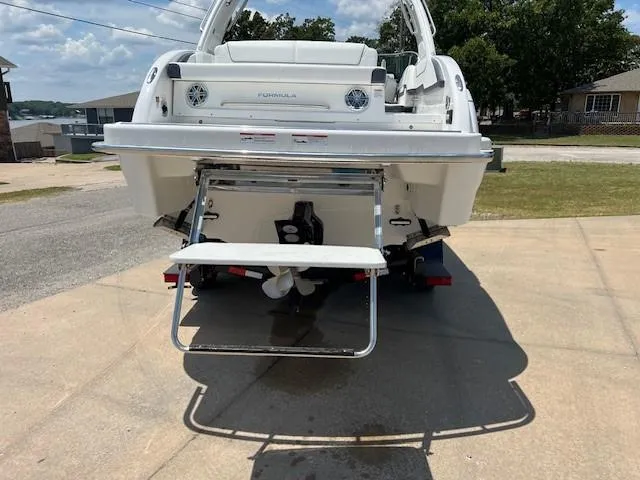 Slide: The Image of 2025 Formula 290 Bowrider boat rear view with swim platform and ladder. - 16