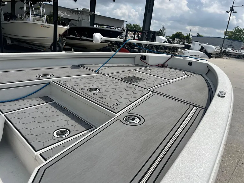 Slide: The Image of Avid 23 Mag 2022 boat deck with hexagonal pattern and built-in measuring ruler. - 4