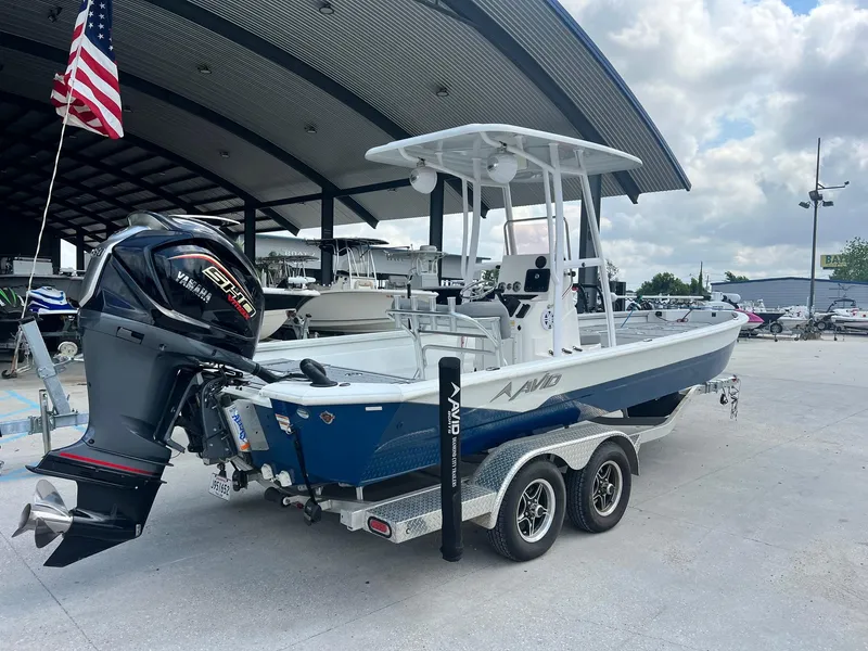 Slide: The Image of 2022 Avid 23 Mag boat on trailer with Yamaha outboard motor. - 6