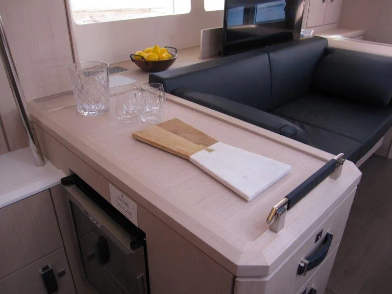 Slide: The Image of Modern interior of 2024 Jeanneau 60 yacht with kitchen and lounge area. - 12