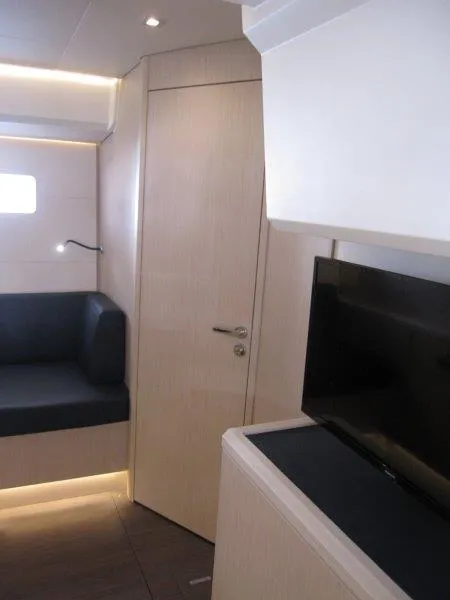 Slide: The Image of Modern interior of 2024 Jeanneau 60 yacht with sleek design and cozy seating. - 41