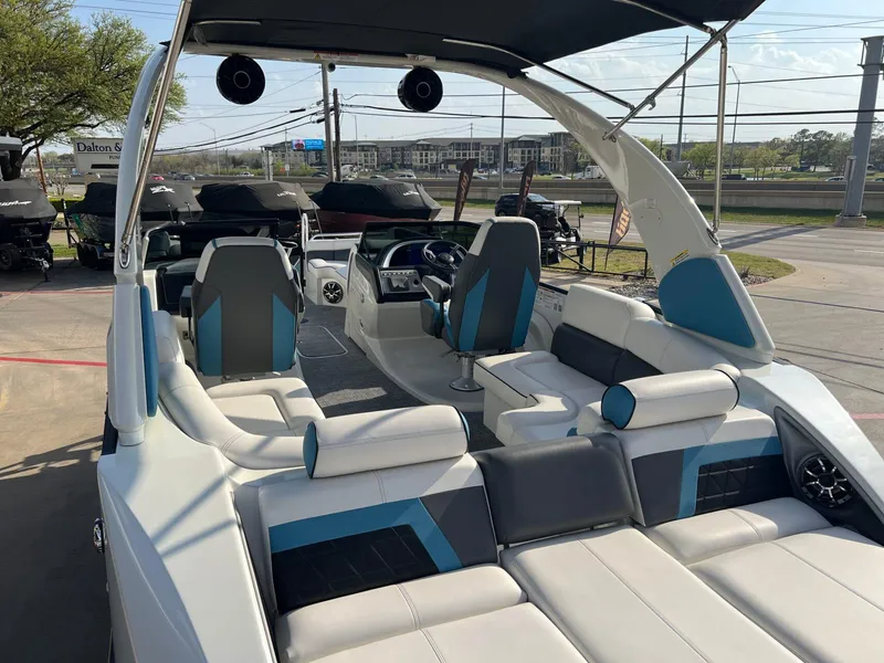 Slide: The Image of 2024 Trifecta 25 SPORT RL9 DC 3PLUS ARCH luxury boat interior with modern seating and controls. - 10
