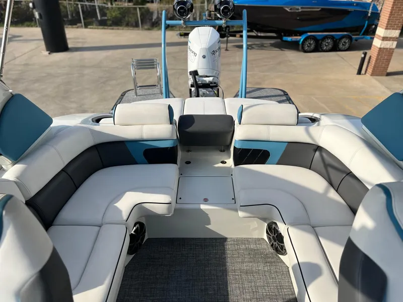 Slide: The Image of 2024 Trifecta 25 SPORT RL9 DC 3PLUS ARCH boat interior with plush seating and modern design. - 11