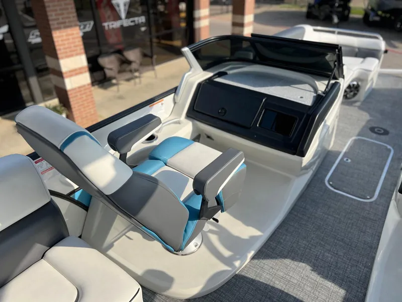 Slide: The Image of 2024 Trifecta 25 SPORT RL9 DC 3PLUS ARCH boat interior with modern seating and dashboard. - 17