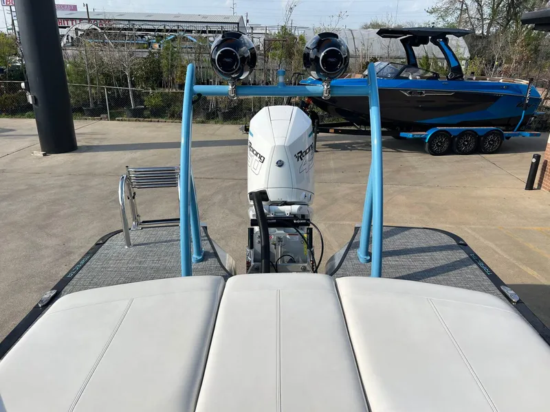 Slide: The Image of 2024 Trifecta 25 SPORT RL9 DC 3PLUS ARCH boat with powerful engine and sleek design. - 23