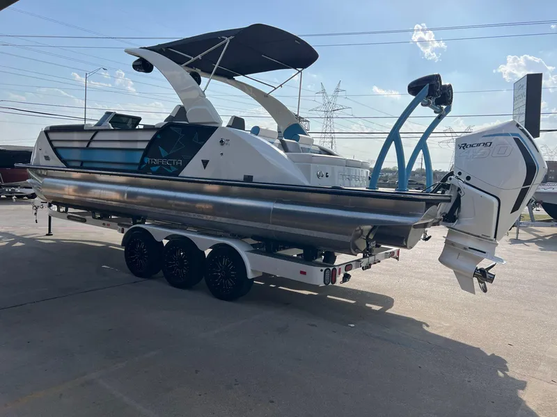 Slide: The Image of 2024 Trifecta 25 SPORT RL9 DC 3PLUS ARCH pontoon boat on trailer, side view. - 5