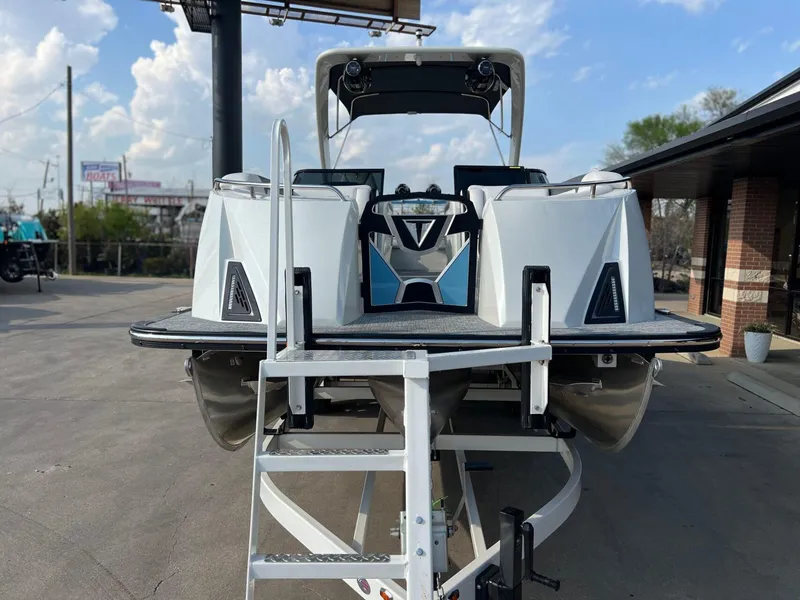 Slide: The Image of 2024 Trifecta 25 SPORT RL9 DC 3PLUS ARCH pontoon boat on trailer, rear view. - 8