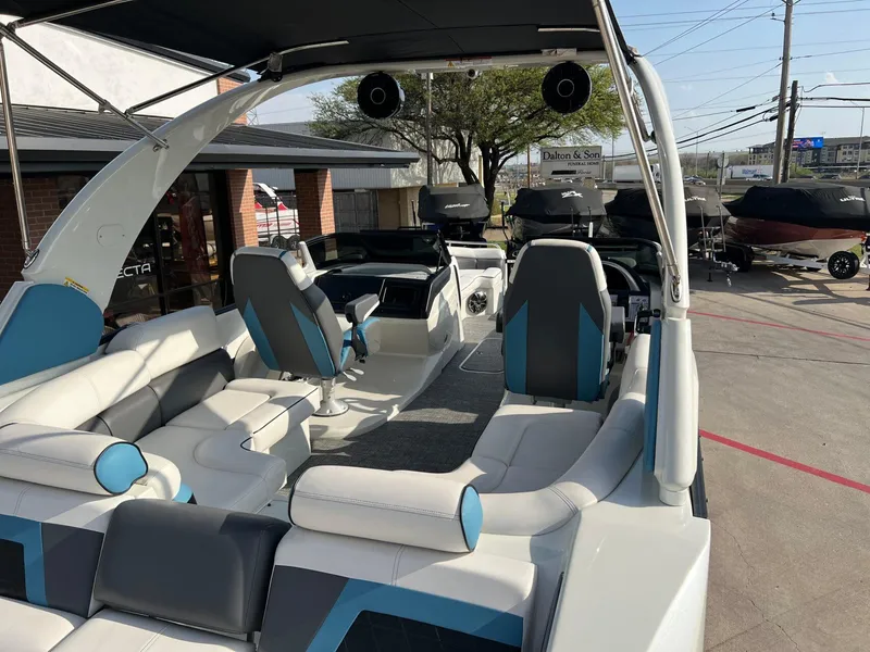 Slide: The Image of 2024 Trifecta 25 SPORT RL9 DC 3PLUS ARCH pontoon boat interior with modern seating and helm. - 9