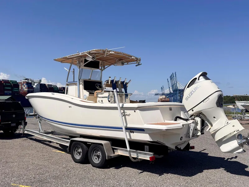 Slide: The Image of 2002 Scout 280 Sportfish boat on trailer with Suzuki outboard motor. - 5