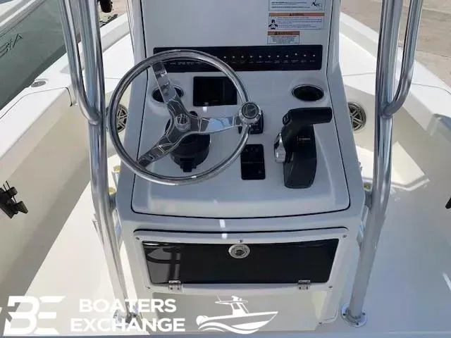 Slide: The Image of 2024 Pathfinder TRS 2200 boat console with steering wheel and controls. - 7