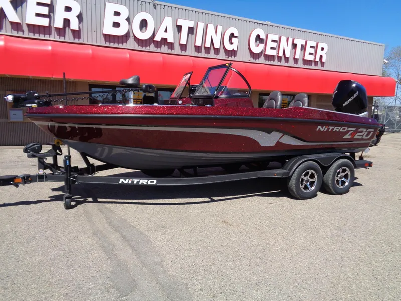 Slide: The Image of 2024 Nitro ZV20 boat on trailer outside Baker Boating Center. - 1