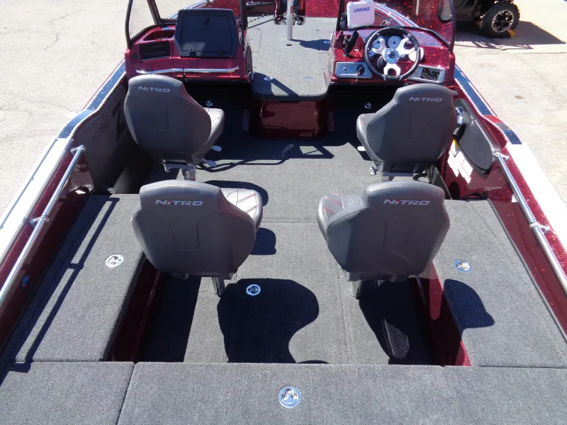 Slide: The Image of 2024 Nitro ZV20 boat interior with four seats and steering console. - 10