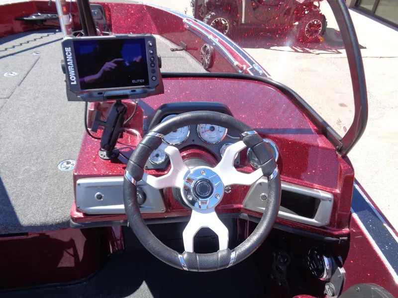 Slide: The Image of 2024 Nitro ZV20 boat dashboard with Lowrance Elite fishfinder and steering wheel. - 11