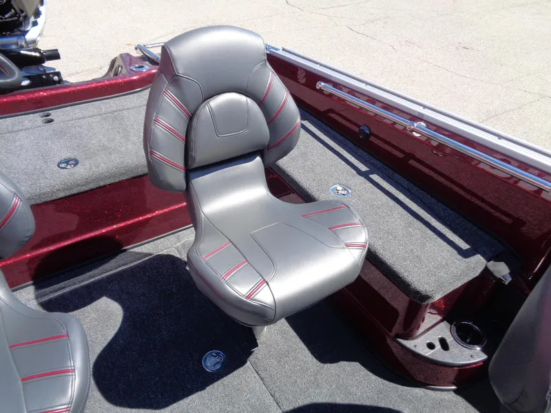 Slide: The Image of 2024 Nitro ZV20 boat interior with gray and red-accented seating. - 14
