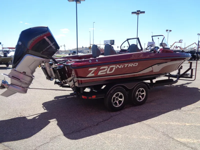 Slide: The Image of 2024 Nitro ZV20 boat on a trailer in a parking lot. - 4