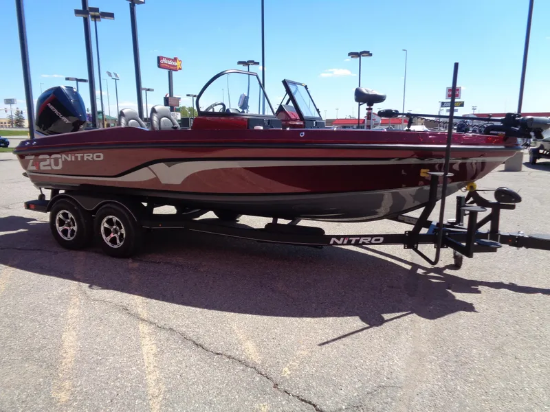 Slide: The Image of 2024 Nitro ZV20 boat on a trailer in a parking lot. - 6