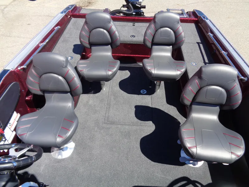 Slide: The Image of 2024 Nitro ZV20 boat interior with four grey seats and red accents. - 9