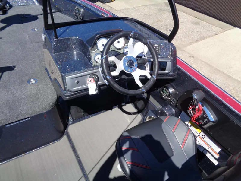 Slide: The Image of 2024 Nitro ZV20 boat cockpit with steering wheel and control panel. - 11