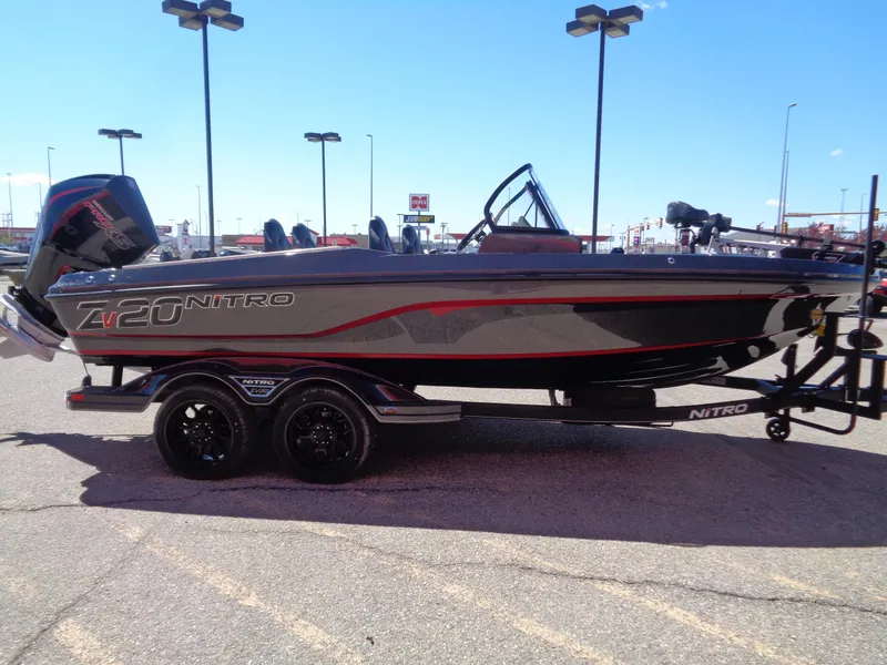 Slide: The Image of 2024 Nitro ZV20 fishing boat on a trailer in a parking lot. - 3