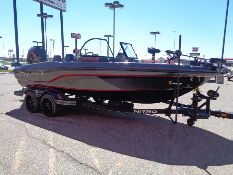 Slide: The Image of 2024 Nitro ZV20 fishing boat on trailer in parking lot. - 4