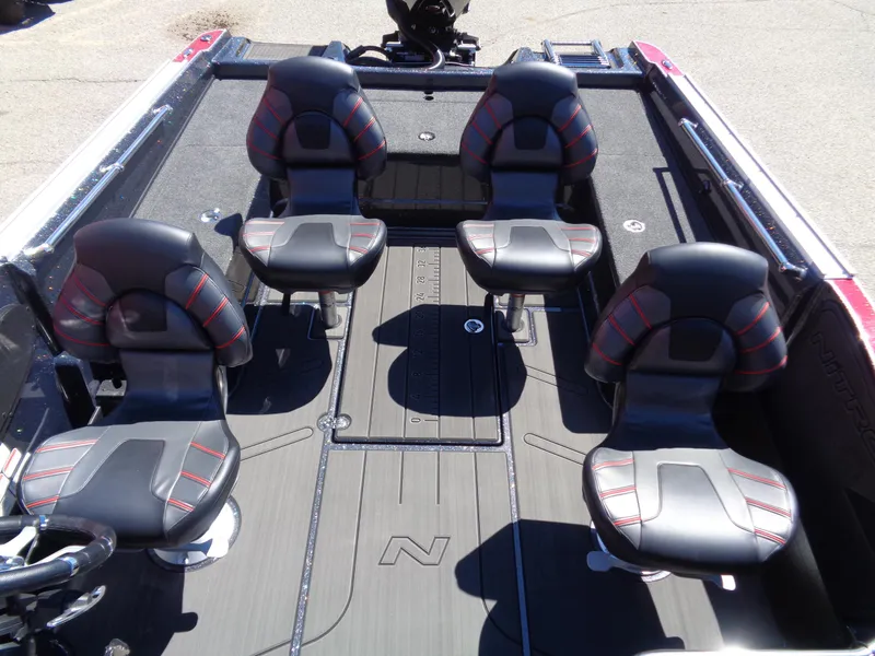 Slide: The Image of 2024 Nitro ZV20 boat interior with four black and red seats. - 7